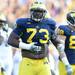 Michigan defensive tackle William Campbell beats his belly as he pumps up the crowd during overtime against Northwestern at Michigan Stadium on Saturday. Melanie Maxwell I AnnArbor.com
